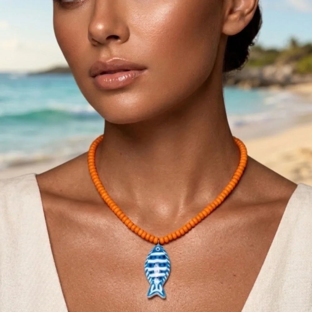 Orange Beaded Necklace with Blue Fish Charm